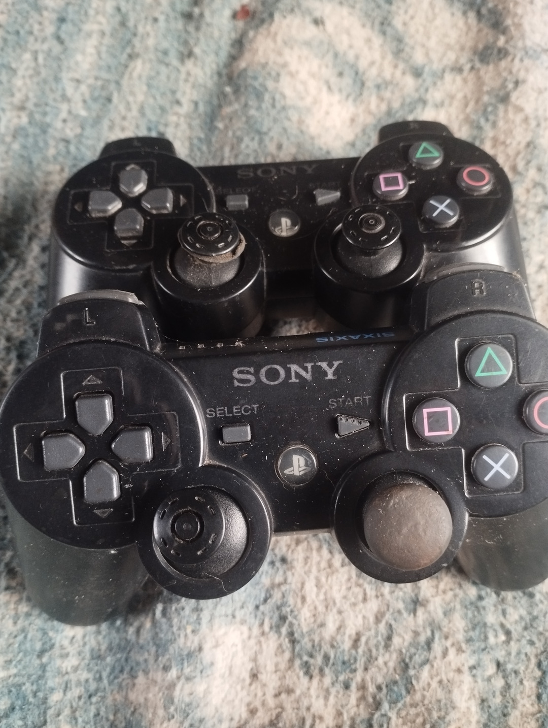 PS3 pads for sale, both going for 8k