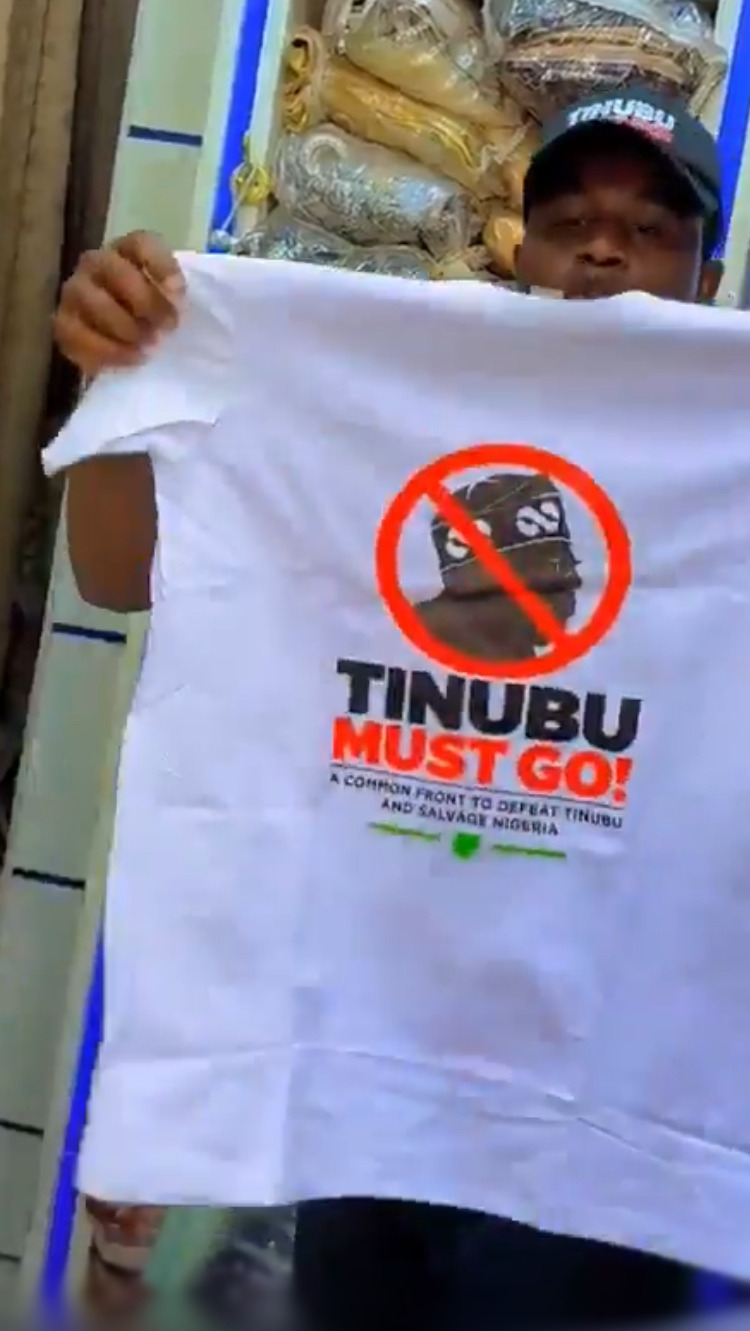 Man Sells “Tinubu Must Go” T-Shirts (Video)