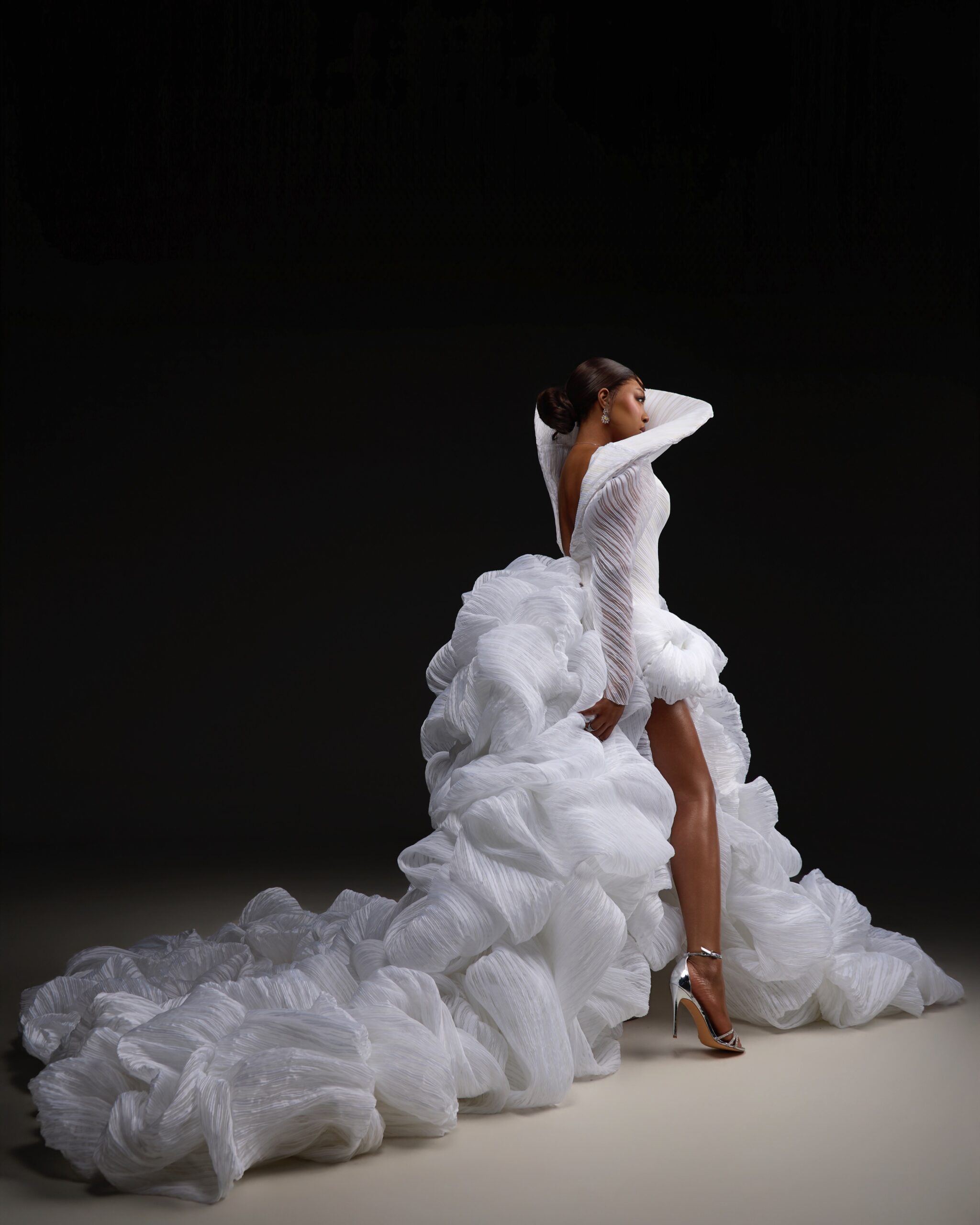 Mide Iwasokun Took on the High Fashion Icon Theme in a Sculptural White Gown With a Dramatic Train
