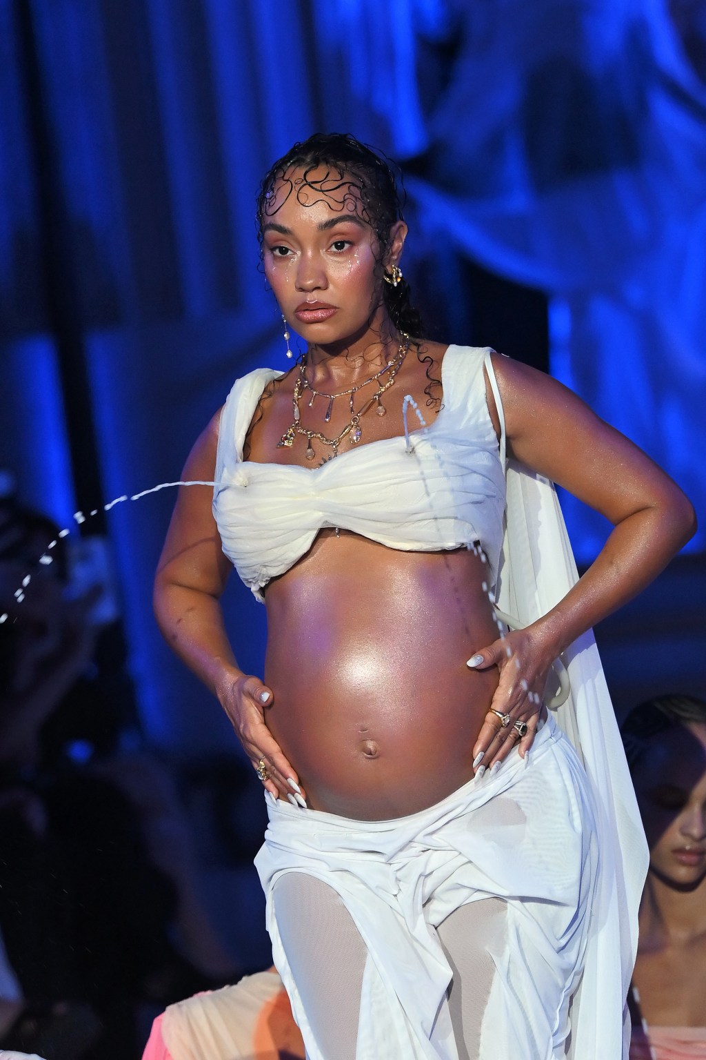Pregnant singer Leigh-Anne Pinnock spreads breast milk’ over models as she shows off huge baby bump