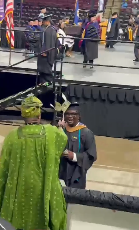 Proud Nigerian dad sprays money on his son at his graduation abroad (Watch)